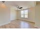 Spacious bedroom with new hardwood floors, a ceiling fan, and a large window at 1456 S Gordon Sw St, Atlanta, GA 30310
