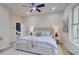 Spacious bedroom featuring a plush bed, soft lighting, and access to the bathroom at 1456 S Gordon Sw St, Atlanta, GA 30310