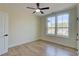 A bright bedroom with hardwood floors, a ceiling fan, and a double window offers plenty of natural light at 1456 S Gordon Sw St, Atlanta, GA 30310