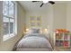 Cozy bedroom with decor, a large window providing natural light, and hardwood floors at 1456 S Gordon Sw St, Atlanta, GA 30310