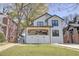 Charming two-story home featuring a manicured lawn, inviting front porch, and modern black-framed windows at 1456 S Gordon Sw St, Atlanta, GA 30310