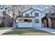 Charming two-story home featuring a welcoming front porch and a well-maintained yard and driveway at 1456 S Gordon Sw St, Atlanta, GA 30310