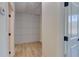 Hallway featuring stylish wainscoting detail, wood floors and white doors at 1456 S Gordon Sw St, Atlanta, GA 30310