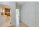 Hallway leading to a bathroom and bedroom, featuring stylish wainscoting and wood floors at 1456 S Gordon Sw St, Atlanta, GA 30310