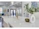 Close-up of a kitchen island with a gold faucet and decor, with living room and dining room in the background at 1456 S Gordon Sw St, Atlanta, GA 30310