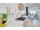 Well-appointed kitchen featuring stainless steel appliances, white cabinets, and a full view of the living room at 1456 S Gordon Sw St, Atlanta, GA 30310