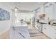 Bright, modern kitchen with a marble-topped island, stainless steel appliances, and white cabinetry at 1456 S Gordon Sw St, Atlanta, GA 30310