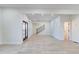 Bright living room with light wood floors, statement wall, and staircase at 1456 S Gordon Sw St, Atlanta, GA 30310