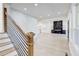 Open-concept space featuring living room, kitchen, staircase with railing, and modern finishes at 1456 S Gordon Sw St, Atlanta, GA 30310