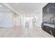 Spacious living room featuring new floors, modern wall design, and open kitchen at 1456 S Gordon Sw St, Atlanta, GA 30310