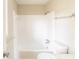 Bathroom featuring white tile shower and tub combination at 2877 Kensington Way, Rex, GA 30273