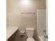A well-lit bathroom featuring white shower, toilet, and vanity at 2877 Kensington Way, Rex, GA 30273