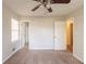 A well lit bedroom with neutral walls, carpet, two entry doors, and a window at 2877 Kensington Way, Rex, GA 30273