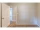 Bedroom featuring neutral walls, plush carpet, and entry to additional room at 2877 Kensington Way, Rex, GA 30273
