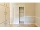 Bright dining area with built-in cabinets, chair rail detail, and closet at 2877 Kensington Way, Rex, GA 30273