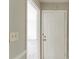 Hallway view showing a white door and neutral wall color leading to other rooms at 2877 Kensington Way, Rex, GA 30273