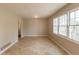 Light-filled living room featuring tile floors and windows for natural light at 2877 Kensington Way, Rex, GA 30273