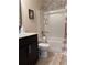Cozy bathroom with shower and tub combo and vanity with granite countertop at 404 After Glow Smt, Canton, GA 30114