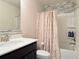 Clean bathroom with a shower and tub, modern fixtures and blue tile accents at 404 After Glow Smt, Canton, GA 30114