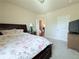 Bedroom features a large bed, soft carpet and natural light at 404 After Glow Smt, Canton, GA 30114