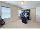 Well-lit bedroom featuring a desk and chair, plus a guitar in the corner at 404 After Glow Smt, Canton, GA 30114
