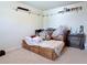 Cozy bedroom featuring a wooden bed frame with drawers, carpet flooring and shelving at 404 After Glow Smt, Canton, GA 30114