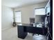 Bright bedroom with a desk by the window and a guitar in the corner at 404 After Glow Smt, Canton, GA 30114