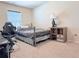 Comfortable bedroom with a steel frame bed, neutral carpet, and a window at 404 After Glow Smt, Canton, GA 30114