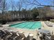 Inviting community pool featuring lounge chairs, tables and well-maintained landscaping at 404 After Glow Smt, Canton, GA 30114