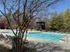 Large community pool with lounge chairs, umbrellas and gazebo amid lush greenery at 404 After Glow Smt, Canton, GA 30114
