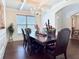 Formal dining room featuring a chandelier, coffered ceiling, and dark wood furniture at 404 After Glow Smt, Canton, GA 30114