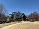 Impressive large home with multiple balconies and a covered front porch at 404 After Glow Smt, Canton, GA 30114