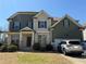 Charming two-story home with a brick and siding exterior and well-maintained landscaping at 404 After Glow Smt, Canton, GA 30114