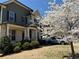 Beautiful home exterior with a blossoming tree adding charm to the landscaped front yard at 404 After Glow Smt, Canton, GA 30114