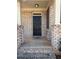Inviting front entrance with a black door, brick surround, and decorative wreath at 404 After Glow Smt, Canton, GA 30114