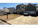 Charming two-story home featuring a spacious driveway and an attached two-car garage at 404 After Glow Smt, Canton, GA 30114