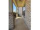 View of a charming front porch with brick columns and a walkway leading to the entrance at 404 After Glow Smt, Canton, GA 30114