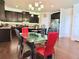 Eat-in kitchen with dark cabinets, stainless appliances, and glass table with seating at 404 After Glow Smt, Canton, GA 30114