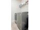 Convenient laundry area featuring a gray washer and dryer set with tile flooring at 404 After Glow Smt, Canton, GA 30114