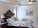 Spacious main bedroom features a tray ceiling, ceiling fan, and luxurious upholstered headboard for serene comfort at 404 After Glow Smt, Canton, GA 30114