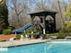 Community pool offers residents a refreshing retreat with a waterslide, comfortable lounge chairs, and well-kept grounds at 404 After Glow Smt, Canton, GA 30114