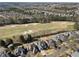 An aerial view showcasing a golf course community with beautiful homes at 5325 Davenport Mnr, Cumming, GA 30041