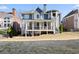 A spacious backyard with a covered patio, perfect for outdoor entertaining and relaxation at 5325 Davenport Mnr, Cumming, GA 30041