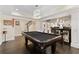 Finished basement with a pool table, recessed lighting, and a bar area with bar stool seating at 5325 Davenport Mnr, Cumming, GA 30041
