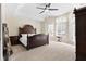 Serene bedroom with a tray ceiling, large windows, and natural light at 5325 Davenport Mnr, Cumming, GA 30041