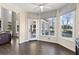 Bright breakfast nook with hardwood floors, large windows, and backyard views at 5325 Davenport Mnr, Cumming, GA 30041