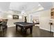 Entertaining game room with a pool table, wet bar and easy access to a bedroom at 5325 Davenport Mnr, Cumming, GA 30041