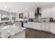 Bright kitchen featuring granite countertops, stainless steel appliances, and a view of the backyard at 5325 Davenport Mnr, Cumming, GA 30041