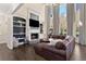 Bright and spacious living room featuring a fireplace and built-in shelving at 5325 Davenport Mnr, Cumming, GA 30041