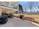 Enjoy outdoor dining on the covered patio, complete with a built-in brick grill area at 5325 Davenport Mnr, Cumming, GA 30041